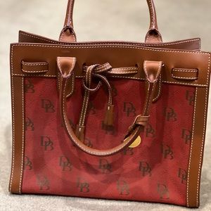 Dooney and Bourke read with monogram bag. Leather handles